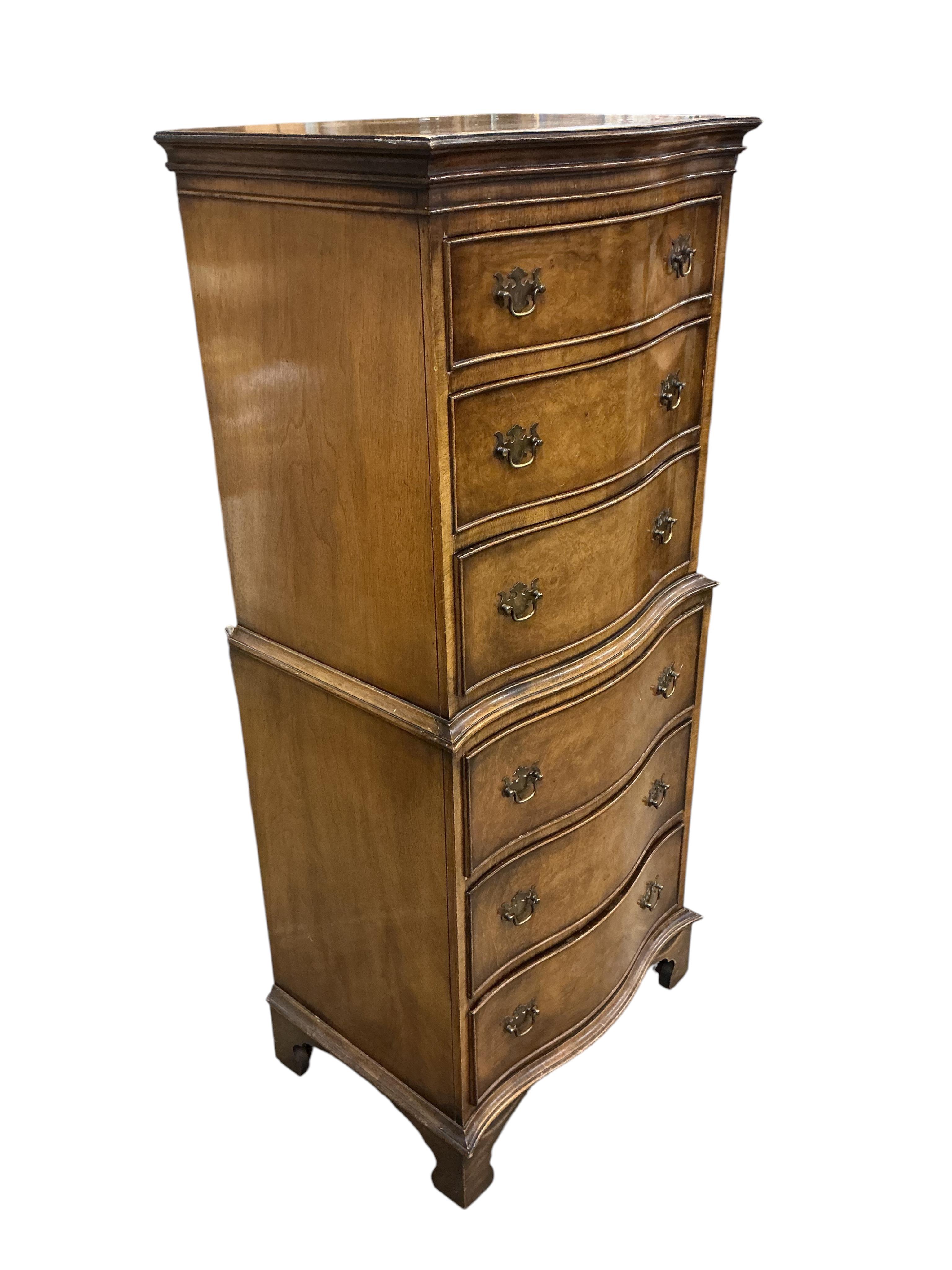 A reproduction George I style narrow walnut serpentine six drawer chest, width 55cm, depth 39cm, height 130cm